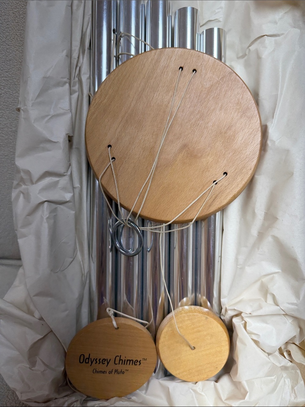 New in box beautiful Pluto Wind Chime - Natural Wood and silver. Hand crafted